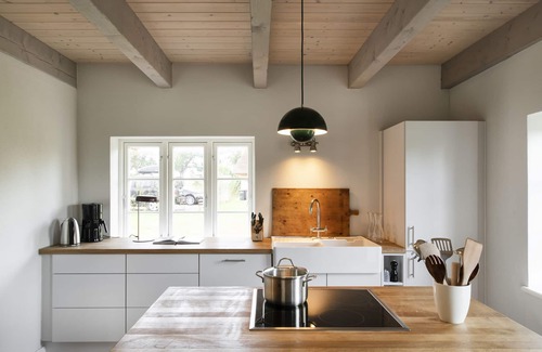 Holzdorf House | Family idyll under thatch with stove and sauna