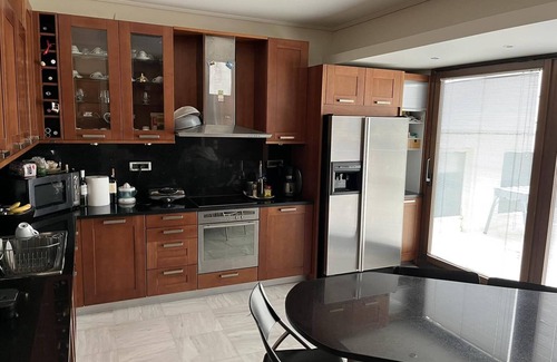 Vouliagmeni Apartment | Family size residence 5 minutes walk from the beaches