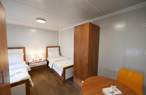 Doha Bed & Breakfast | Fan Village Cabins Free Zone