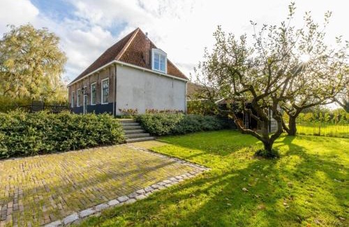 Heinkenszand House | Farmhouse in Zeeland with Windmill Views