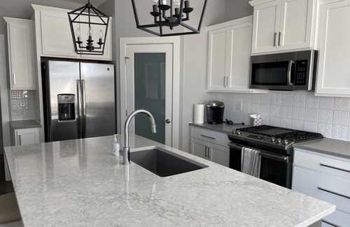 Johnston Villa | Farmhouse style Villa with front porch, 4 bedroom, 3 baths, and 2 living areas