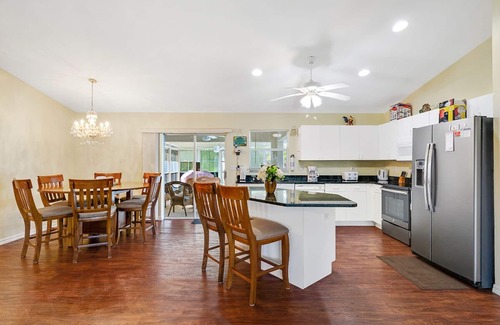 Biggar House | Fenced, private, family friendly villa with exotic poolside views near airport.