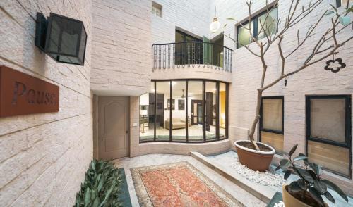 DLF City Hotel | Firebrick Boutique Residences - GARNET HOUSE