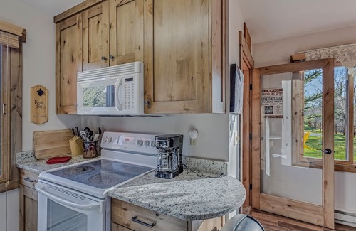 Clark Cabin | Fireplace, and a fully equipped kitchen with a dishwasher and pet friendly!