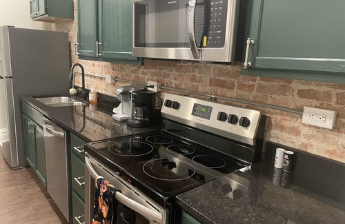 Dubuque Apartment | Fireplace and Farmers Market Cozy!