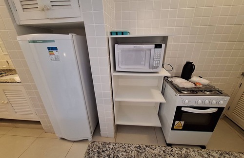 Praia do Pauba Apartment | Flat Praia de Pauba, right on the sand, heated pool, barbecue and sauna.