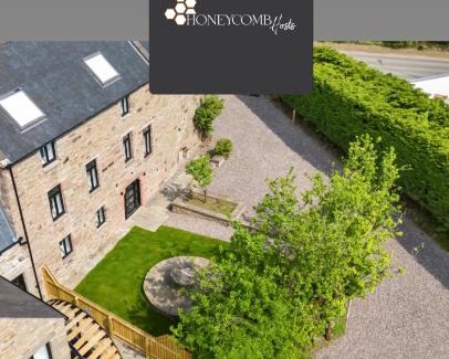 Douglas and Angus Apartment | FLOUR MILL HOUSE at PITKERRO MILL, 4 double bedrooms, TVs, 3 en-suite, separate shower, wc, fully equipped kitchen, games room, large family lounge, private parking, WiFi, private garden and courtyard, long stay rates available through Honeycomb Hosts