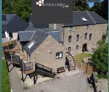 Douglas and Angus Apartment | FLOUR MILL HOUSE at PITKERRO MILL, 4 double bedrooms, TVs, 3 en-suite, separate shower, wc, fully equipped kitchen, games room, large family lounge, private parking, WiFi, private garden and courtyard, long stay rates available through Honeycomb Hosts
