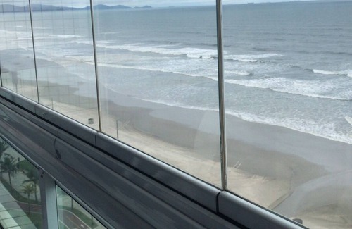 Caicara Apartment | Foot in the sand with barbecue on the balcony facing the sea, children welcome