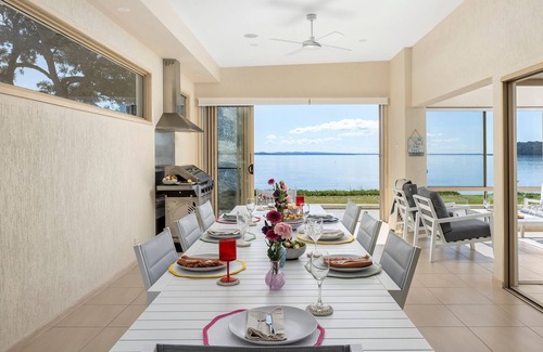 Salamander Bay House | Foreshore Delight offers a tranquil holiday retreat with breathtaking water views
