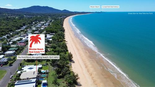 Wongaling Beach Apartment | Frangipani Place - Absolute Beachfront