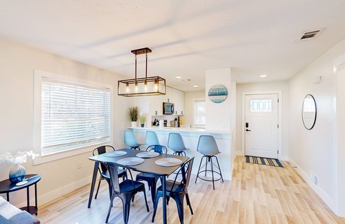 Bay Acres House | Full duplex near beach with renovated interior, screened porches-Dogs ok