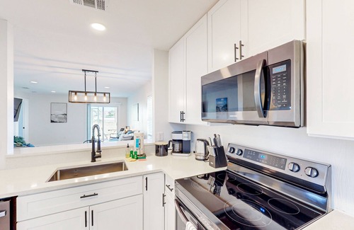 Bay Acres House | Full duplex near beach with renovated interior, screened porches-Dogs ok