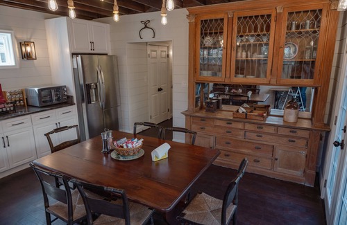 Cleveland Park House | Fully renovated 1800s Carriage House seamlessly blends history w/modern luxury.
