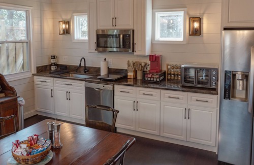 Cleveland Park House | Fully renovated 1800s Carriage House seamlessly blends history w/modern luxury.