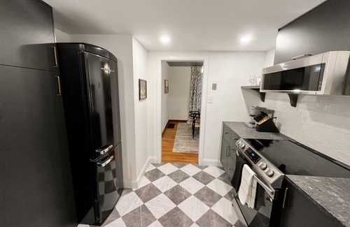 Grandview Heights Condo | Garden Suite - Sauna + King Bed! -Central location