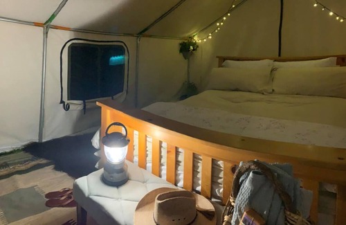 Dubois RV Rental | Glamping at Arcady Ridge Ranch-Canvas Tent, Queen Bed, Running Water + Wifi