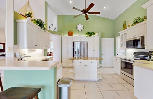 White Marsh House | Golf course front home with private pool, lanai, & internet