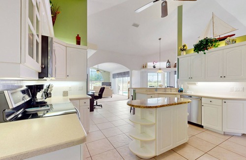 White Marsh House | Golf course front home with private pool, lanai, & internet