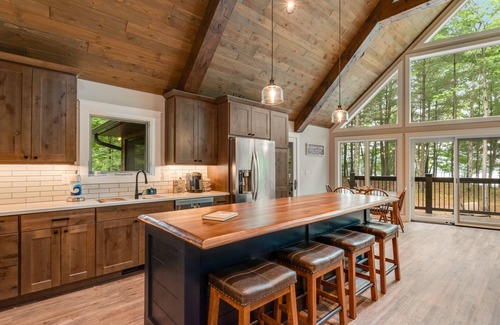 Lac du Flambeau House | Gorgeous lakefront home with private dock, canoe, kayak, firepit & fireplace