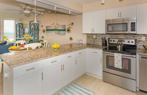 New Smyrna Beach Condo | Gorgeous Oceanfront Condo-Walk to Flagler-Updated Beachy Chic-Best NSB Location!