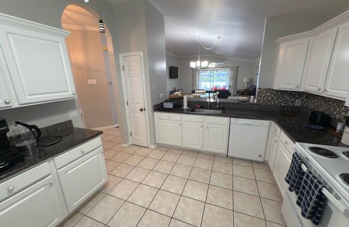 Beachwalk Isles House | Gorgeous sunsets over the lake with heated pool! Close to beaches and golf
