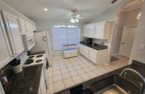 Beachwalk Isles House | Gorgeous sunsets over the lake with heated pool! Close to beaches and golf