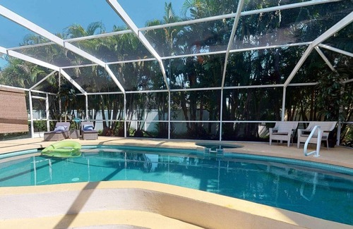 Bay Acres House | Gorgeous Updated Heated Saltwater Pool Home, WiFi, Dog Friendly, Kayak Launch & Park, Garage