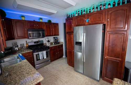 Tropic House | Gorgeous Urban Oasis w/Hot Tub, HEATED POOL and Private Movie Theater by RedAwning