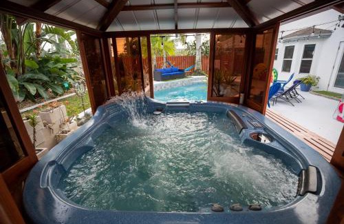 Tropic House | Gorgeous Urban Oasis withHot Tub, HEATED POOL and Private Movie Theater home