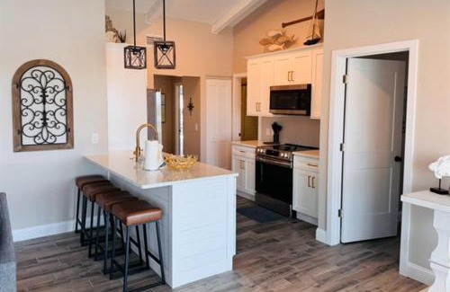 Spring Hill House | Gorgeous vacation home on the water with heated pool and sand!