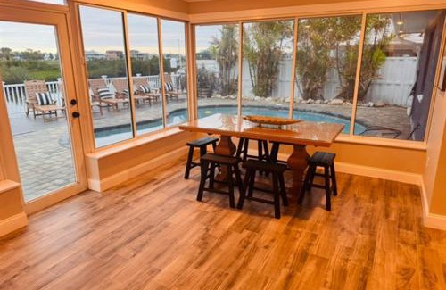 Spring Hill House | Gorgeous vacation home on the water with heated pool and sand!