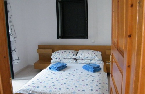 Lefktron House | Greek 140 m2 stone house , 3 bedrooms, with beautiful sea and mountain views.