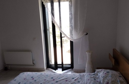 Lefktron House | Greek 140 m2 stone house , 3 bedrooms, with beautiful sea and mountain views.