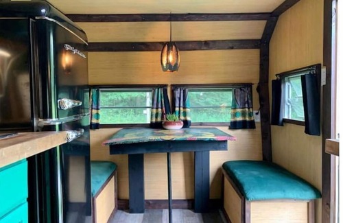 Monticello RV Rental | Groovy Vintage RV In the Woods