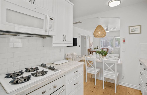 West Newport House | Ground-floor beach cottage with a furnished patio, AC, parking, & washer/dryer