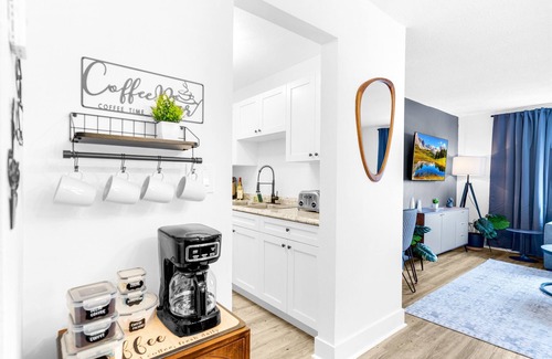 Survey Creek Apartment | Ground Floor - Water View - Palm Wave Says