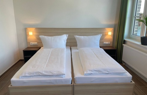 Pasewalk Bed & Breakfast | Guest house vacation apartment - 105 - Lokschuppen Pasewalk- Guest houses with double rooms, single rooms and