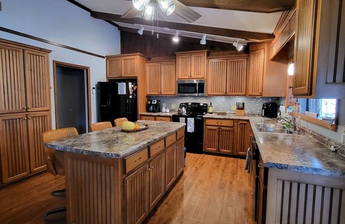 Centre House | Heron's Rest is a lakefront house with cabin feel, truly a diamond in the rough!