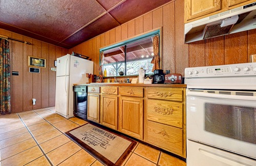 Volcano House | Hidden paradise with a hot tub, wood fireplace, large lanai, & jetted tub