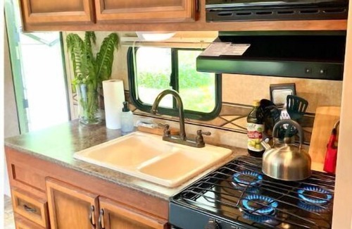 Decorah House | Hideaway Camper by the Cave & Waterfall, Kayak & Canoe Rentals, Trout Fishing