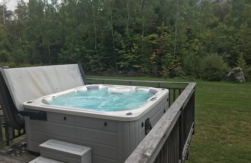 Carrabassett Valley Condo | High End 3 bed 3 bath ski in/out condo with private hot tub on the back deck!