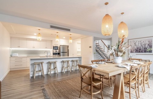 North Creek Apartment | Highlighted by a private outdoor entertaining space with a heated outdoor spa.