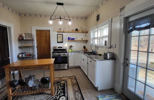 South Colton House | Historic 1840's home on Raquette River with creek, large lawn, view of waterfall