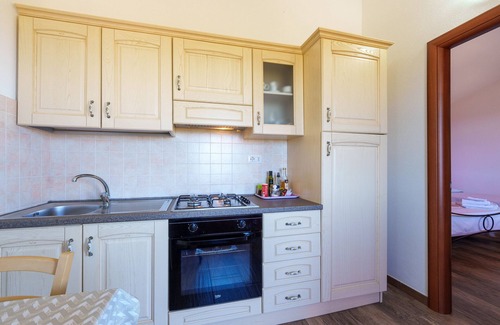 Aglientu Apartment | Holiday Apartment "Casa Ginepro Piscina E Vista Mare" with Sea View, Shared Pool & Wi-Fi