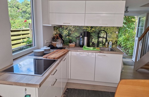 Guestrow House | Holiday Home 'Am Wasser, Bootshaus' with Private Terrace