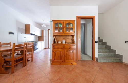 Porto Pino House | Holiday Home 'Casa Giuliana' with Shared Terrace, Private Garden and Air Conditioning