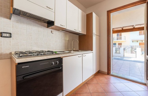 Porto Pino House | Holiday Home 'Casa Giuliana' with Shared Terrace, Private Garden and Air Conditioning