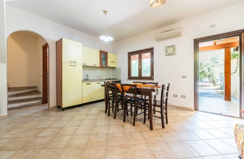Porto Pino House | Holiday Home 'Casa Martini' with Private Terrace, Private Garden and Air Conditioning