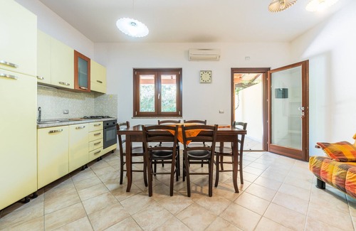 Porto Pino House | Holiday Home 'Casa Martini' with Private Terrace, Private Garden and Air Conditioning